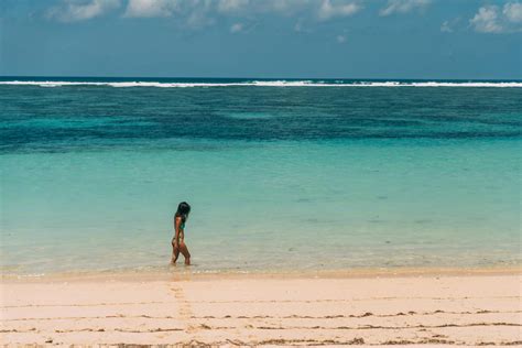 sexy walk|Woman In Swimsuit Walking at the Beach .